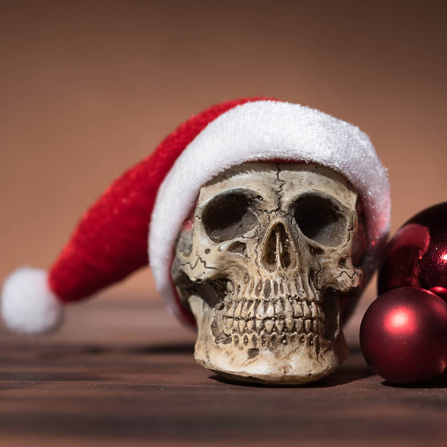 skeleton skull with santa hat and christmas balls