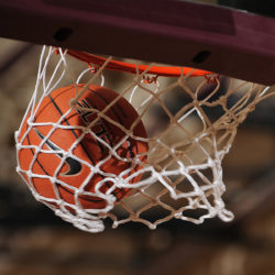 Basketball Going Through A Basketball Hoop