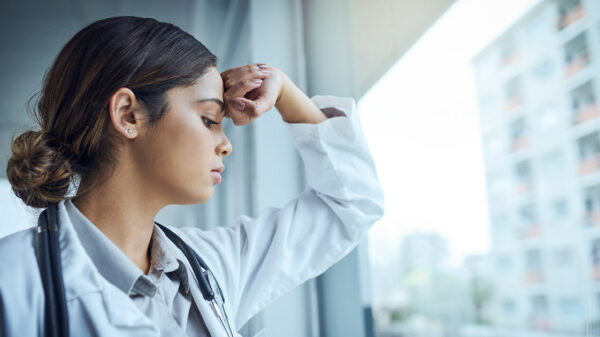 stressed out doctor staring out window