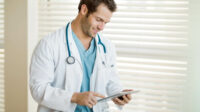 doctor reading tablet