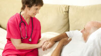 older nurse with patient